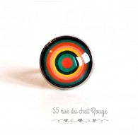 Farbiger Cabochonring, unendliche Kreise, grün und orange